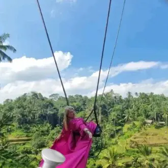 A guest on the jungle swing over the rice terraces